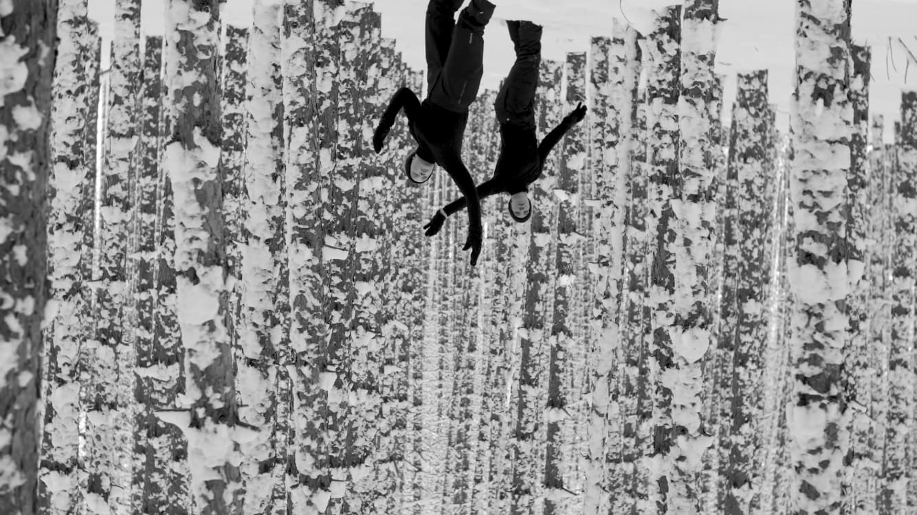 Dancers in snow-covered forest